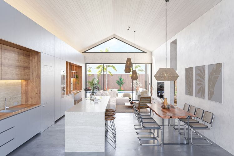 Área central de vivienda con amplios ventanales que promueven la ventilación y la entrada de luz natural