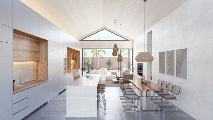 Área central de vivienda con amplios ventanales que promueven la ventilación y la entrada de luz natural