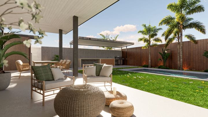 Área de barbacoa y jardín con diseño de paisajismo