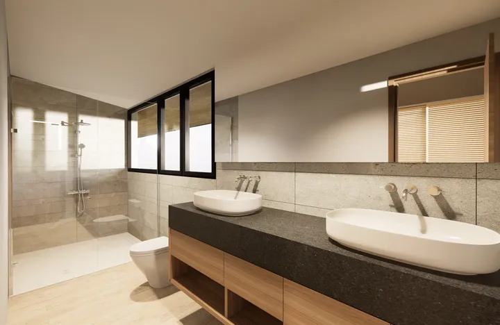 Modern and elegant bathroom with a minimalist design, including a large shower with glass partition, two vessel sinks over a dark vanity with wooden cabinets and two sophisticated mirrors.