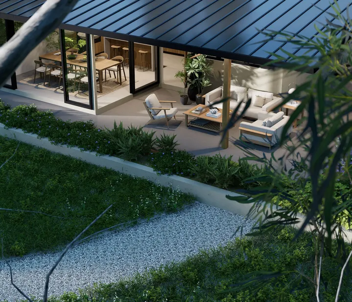 Espacio al aire libre con sillones, mesa de centro y comedor integrado, ideal para reuniones familiares y conexión con la naturaleza.